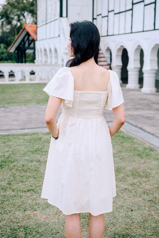 Back View of SAND Mira A-Line Dress smocked back and ruffle sleeves in sand, family/couple matching available