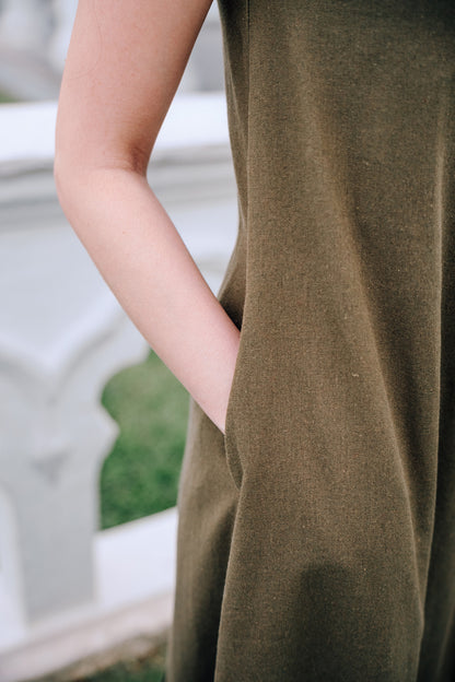 Close up of side pocket of woman wearing MOSS Isla Dress in breathable moss green linen blend