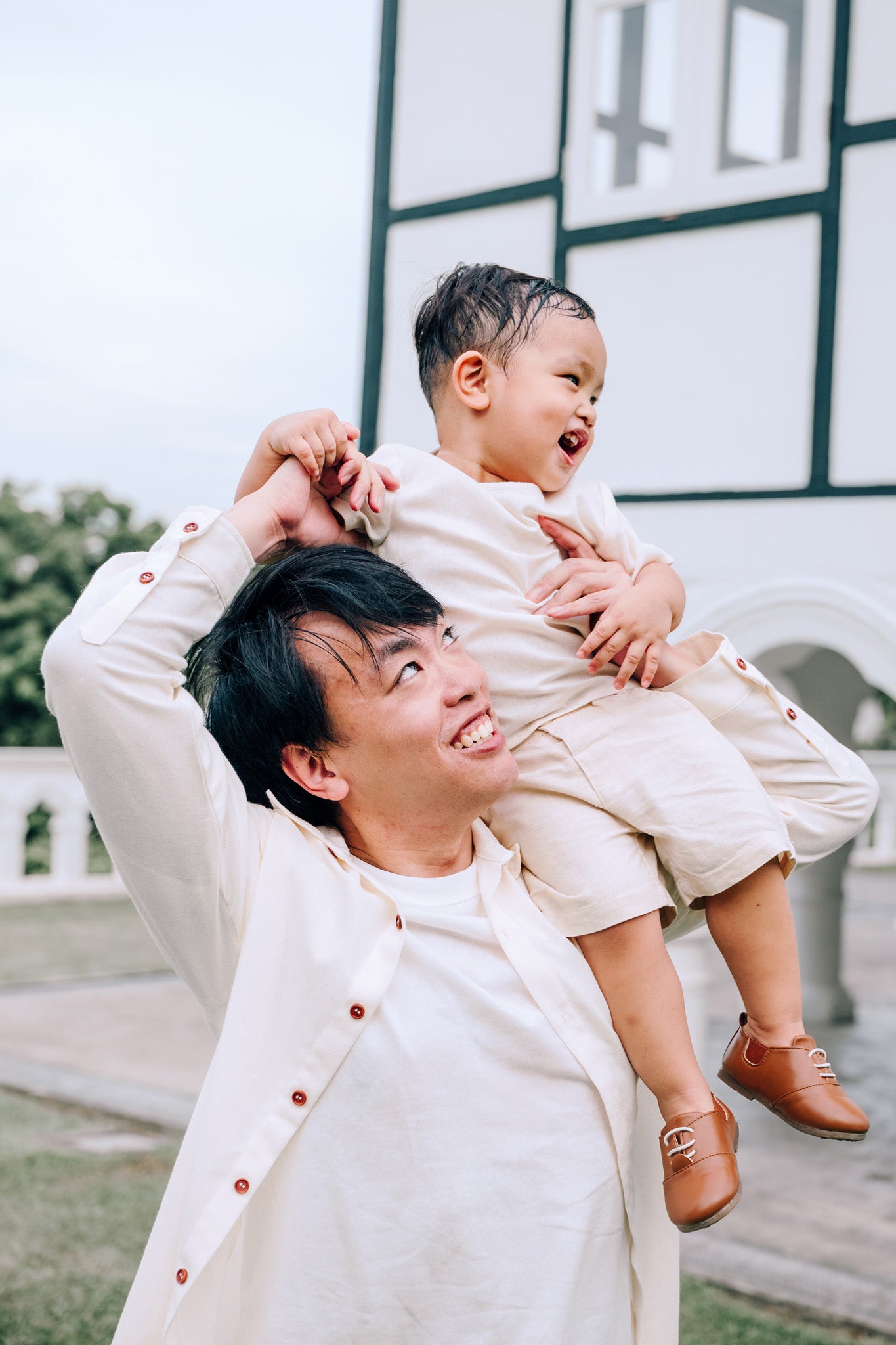 Father and son wearing matching SAND Elio Shirt and SAND Mini Noa T-Shirt in soft neutral tones
