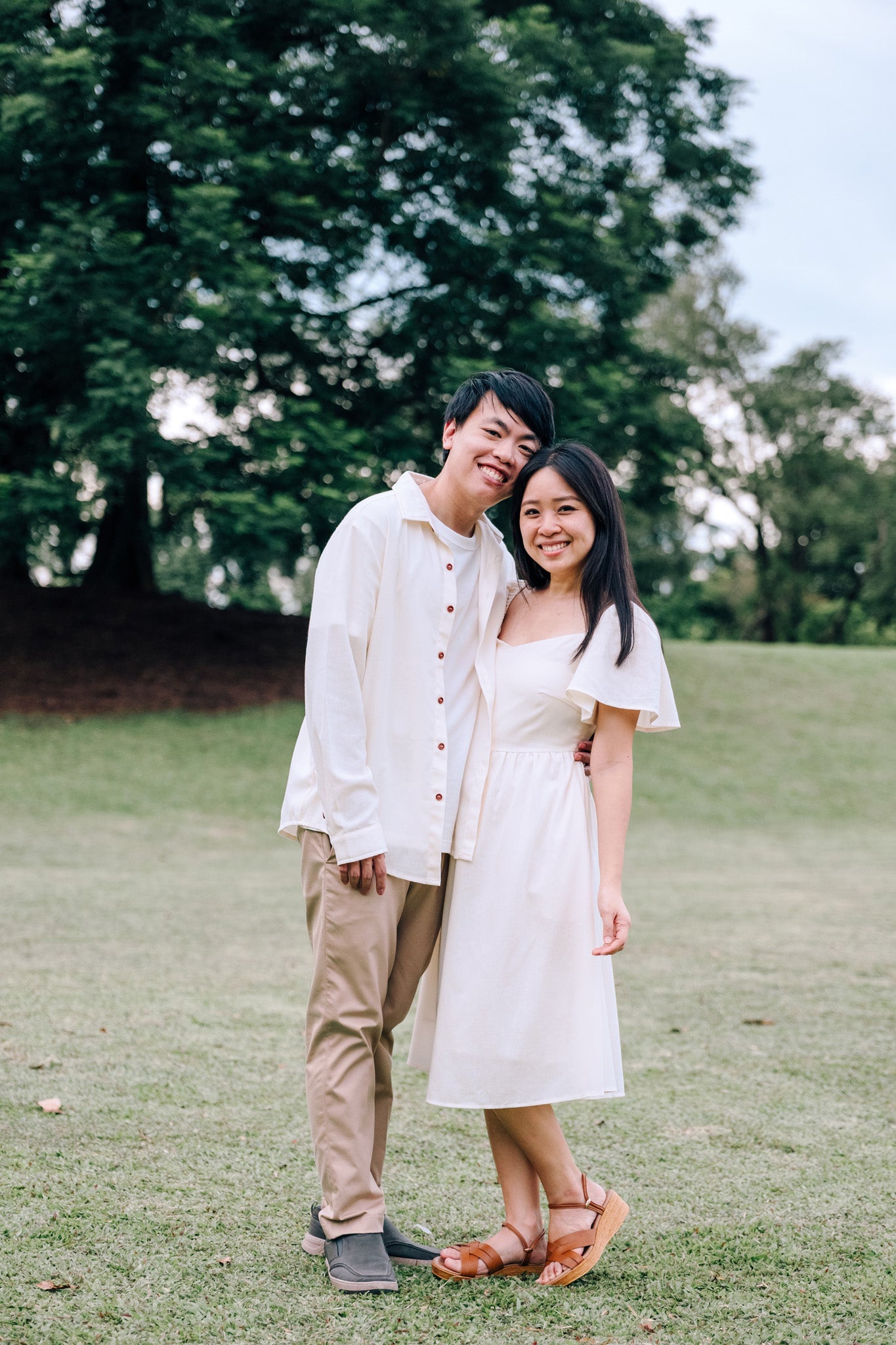 Couple wearing SAND Mira Dress and SAND Elio Shirt in matching sand tones