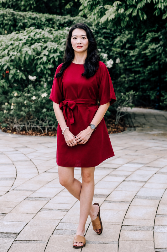 Woman in Burgundy linen Dahlia Dress