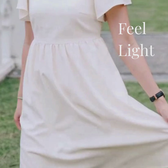 Video of woman in sand linen dress