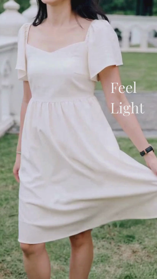 Video of woman in sand linen dress
